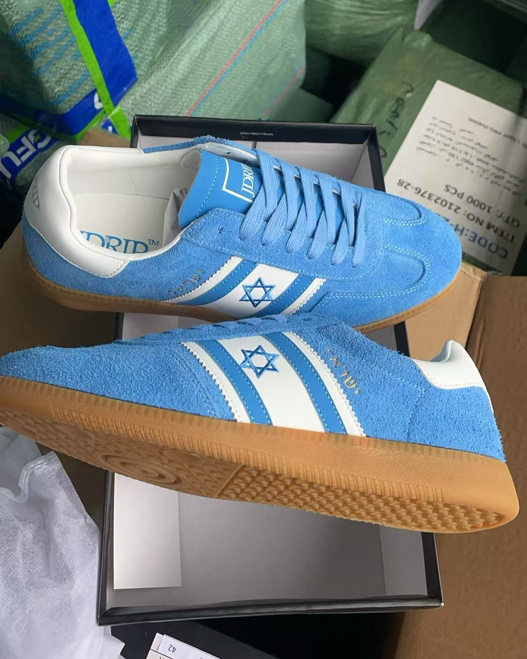 Israel shoes. Blue Israel sneakers with an Israeli flag design on an opened shoe box